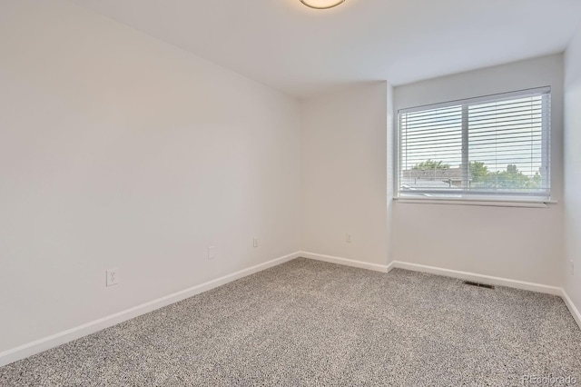 19033 E 22nd Cir, Aurora, CO 80011 - carpeted spare room featuring baseboards