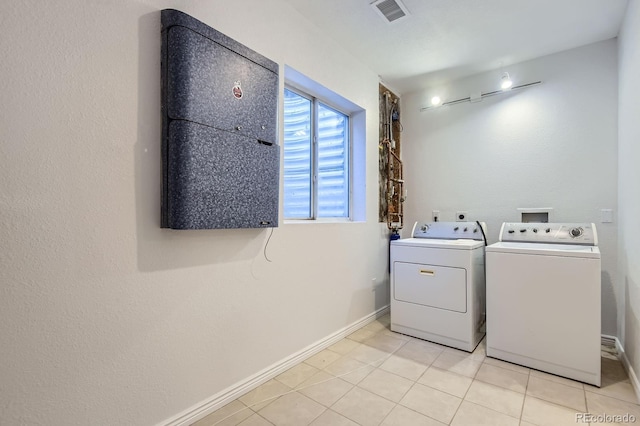 19033 E 22nd Cir, Aurora, CO 80011 - laundry room featuring washing machine and clothes dryer and light tile patterned flooring