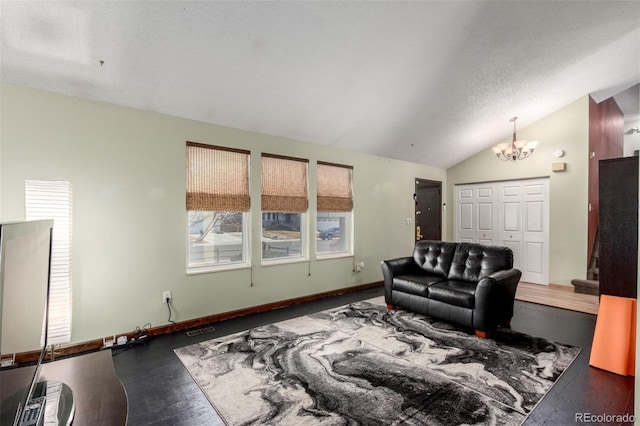 living room with lofted ceiling, a textured ceiling, a notable chandelier, visible vents, and baseboards