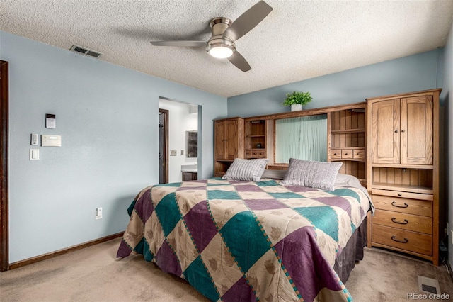 bedroom with a textured ceiling, light carpet, a baseboard heating unit, visible vents, and baseboards