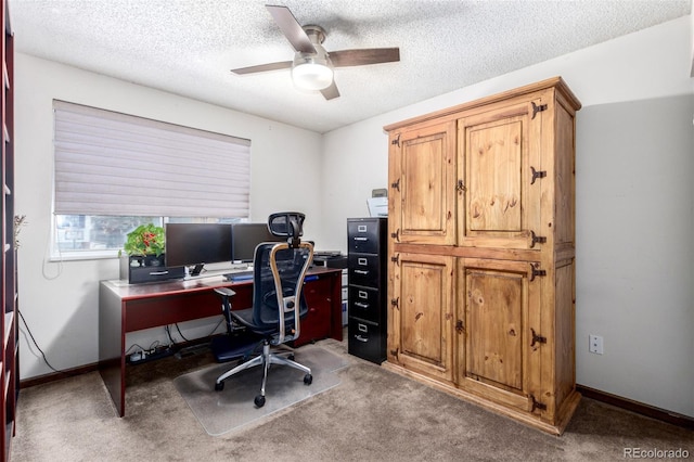 office with carpet, baseboards, ceiling fan, and a textured ceiling