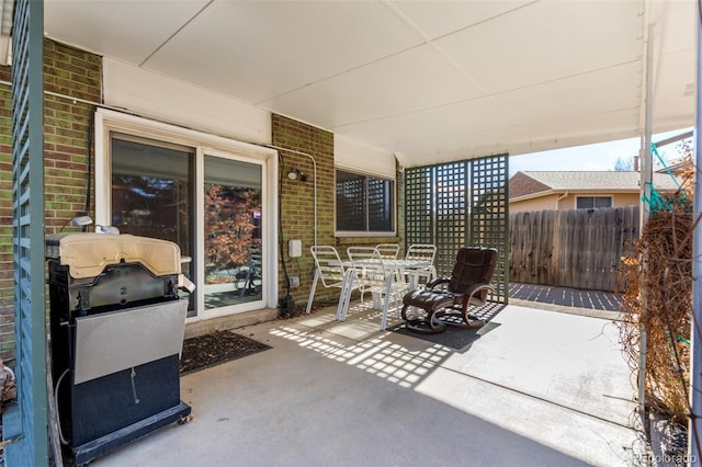 view of patio / terrace featuring outdoor dining area, area for grilling, and fence