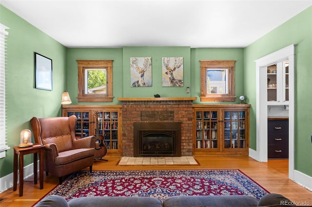 4321 Winona Ct, Denver, CO 80212 - living room with wood finished floors, baseboards, and a fireplace