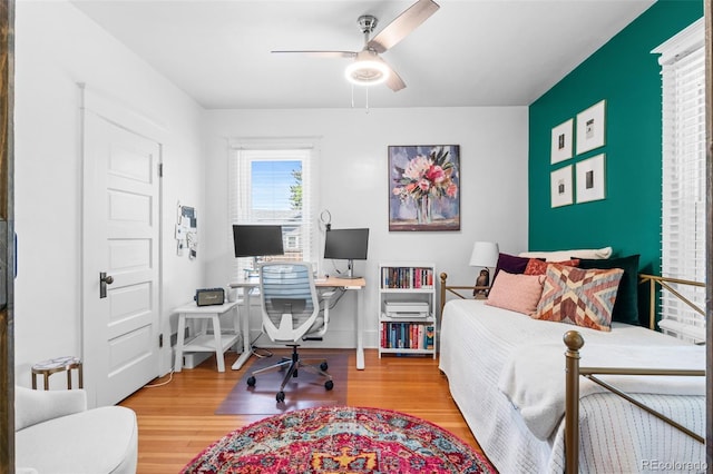 4321 Winona Ct, Denver, CO 80212 - bedroom with wood finished floors and an office area