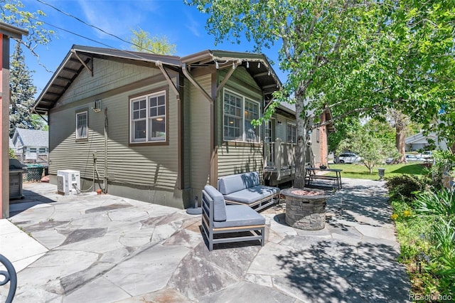 4321 Winona Ct, Denver, CO 80212 - rear view of property with an outdoor fire pit, a patio, and ac unit