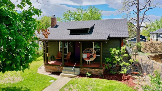 4321 Winona Ct, Denver, CO 80212 - view of front facade featuring a chimney, a porch, and roof with shingles