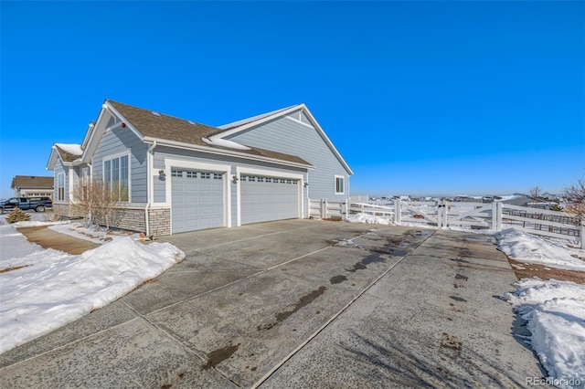 view of side of property with a garage