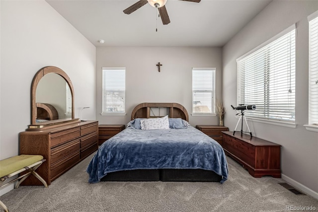 bedroom with light carpet and ceiling fan