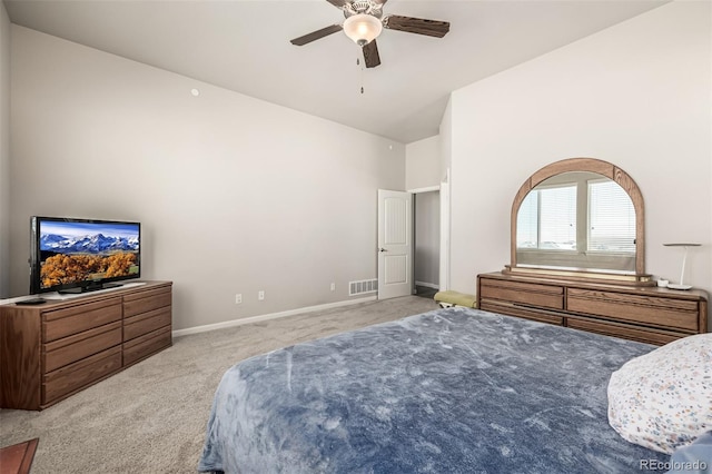 carpeted bedroom with lofted ceiling and ceiling fan