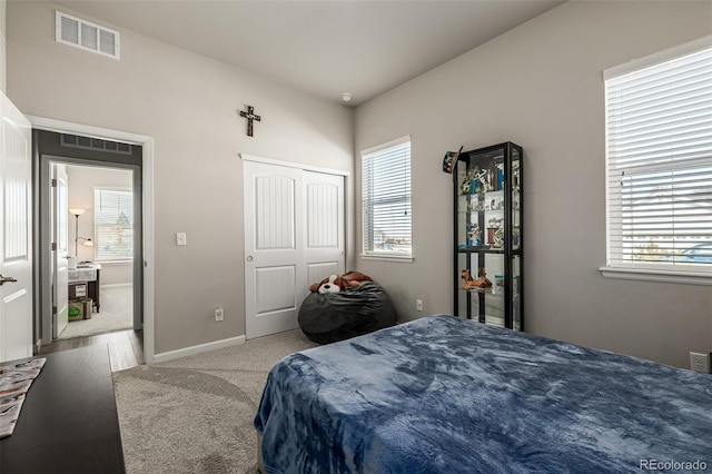 carpeted bedroom featuring a closet