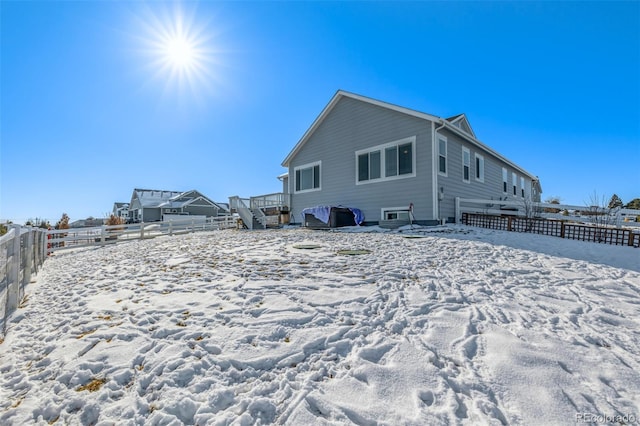 view of snow covered property