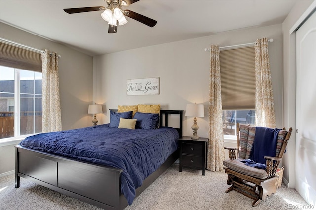 bedroom featuring a ceiling fan, baseboards, and carpet floors