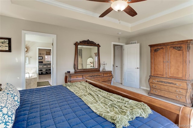 bedroom featuring a raised ceiling, crown molding, visible vents, and ceiling fan