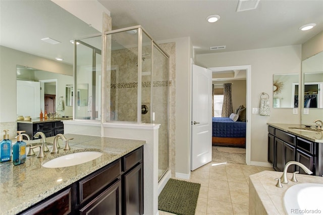 full bathroom with a shower stall, visible vents, and a sink