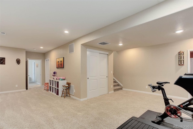 exercise room with recessed lighting, visible vents, and carpet