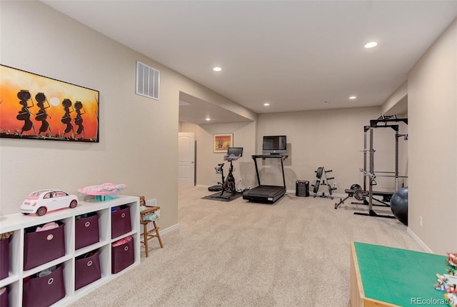 exercise area featuring visible vents, recessed lighting, baseboards, and carpet