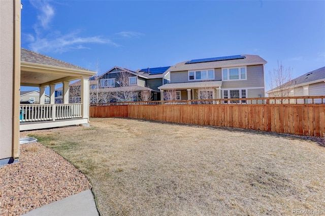 view of yard with a residential view and fence