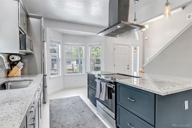 4013 S Carson St Unit C, Aurora, CO 80014 - kitchen featuring stainless steel electric range oven, a sink, island range hood, a center island, and light stone countertops