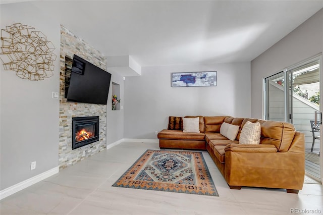 4013 S Carson St Unit C, Aurora, CO 80014 - living area featuring a stone fireplace and baseboards