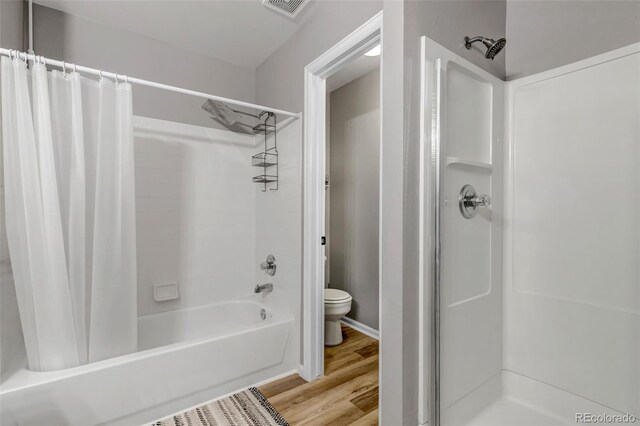 4013 S Carson St Unit C, Aurora, CO 80014 - bathroom featuring toilet, wood finished floors, and shower / bath combo