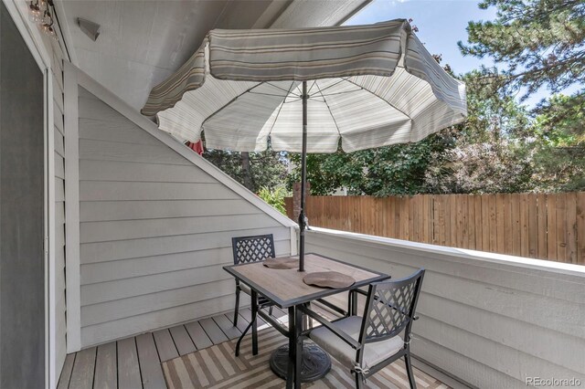 4013 S Carson St Unit C, Aurora, CO 80014 - wooden deck with outdoor dining area