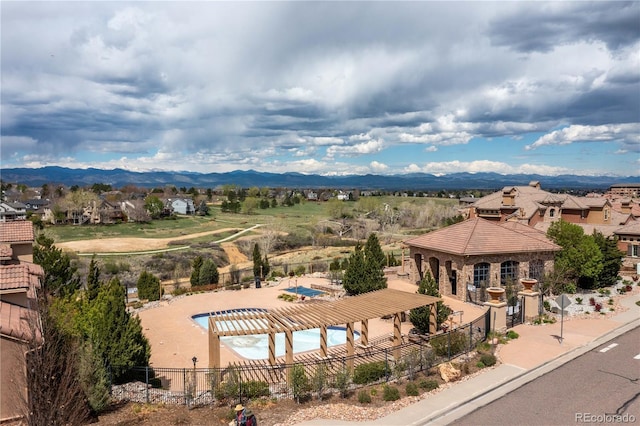 3454 Cascina Pl Unit D, Highlands Ranch, CO 80126 - drone / aerial view of a mountain backdrop and a pool