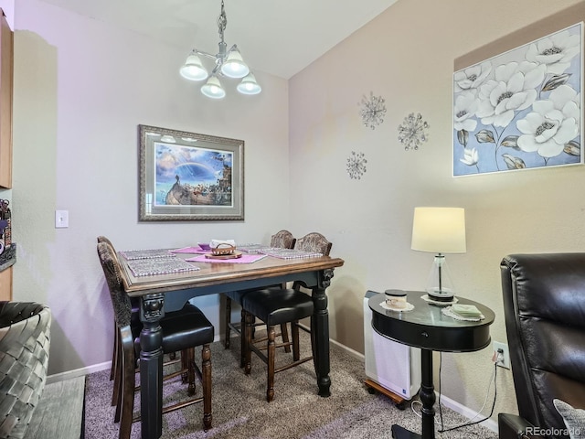 dining area with dark colored carpet, vaulted ceiling, and an inviting chandelier