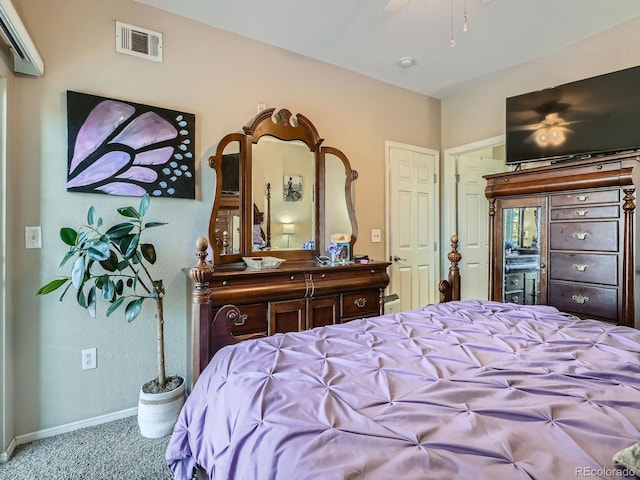 bedroom with ceiling fan and carpet floors