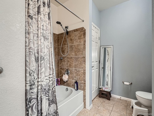 bathroom with toilet, tile patterned floors, and shower / bath combo with shower curtain