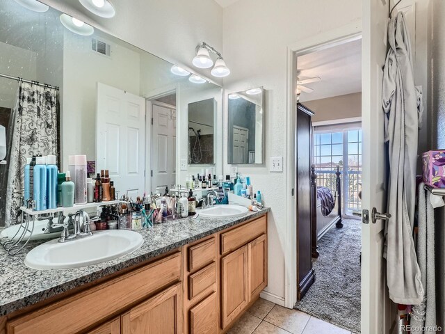 bathroom with tile patterned flooring, vanity, ceiling fan, and a shower with shower curtain