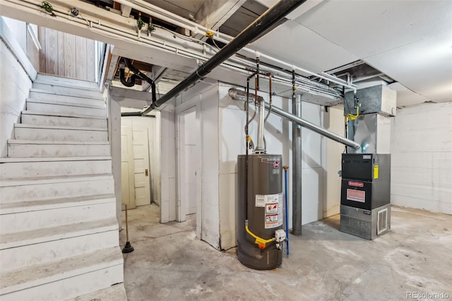 532 Front St, Fairplay, CO 80440 - unfinished below grade area featuring water heater, stairs, and heating unit