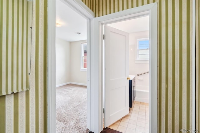 532 Front St, Fairplay, CO 80440 - hallway featuring baseboards, wallpapered walls, and light colored carpet