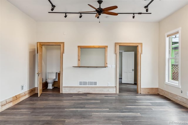 532 Front St, Fairplay, CO 80440 - unfurnished living room with rail lighting, wood finished floors, ceiling fan, and baseboards