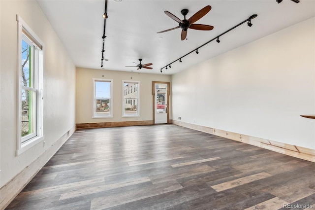 532 Front St, Fairplay, CO 80440 - unfurnished room featuring track lighting, a ceiling fan, wood finished floors, and baseboards