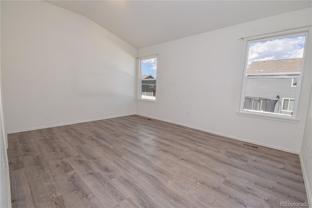 1057 Mt Oxford Ave, Severance, CO 80550 - empty room with lofted ceiling and wood finished floors