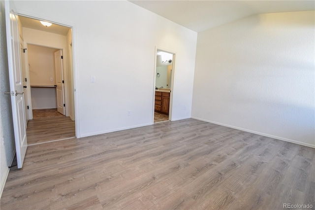 1057 Mt Oxford Ave, Severance, CO 80550 - empty room featuring lofted ceiling and wood finished floors