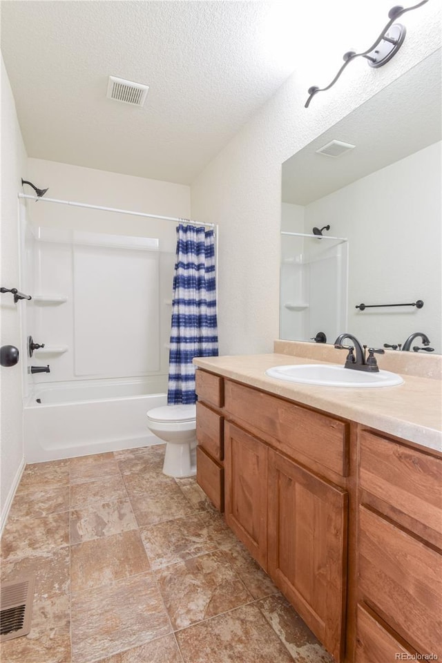 1057 Mt Oxford Ave, Severance, CO 80550 - bathroom featuring vanity, shower / tub combo, and a textured ceiling