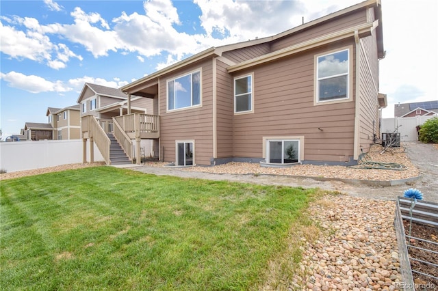 1057 Mt Oxford Ave, Severance, CO 80550 - rear view of house featuring stairs and a wooden deck