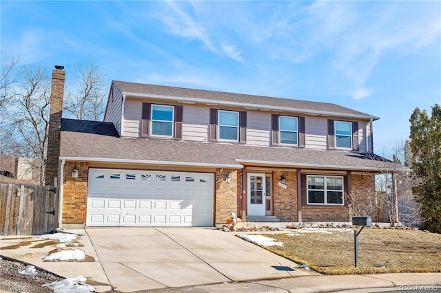 traditional-style home with brick siding, a shingled roof, fence, driveway, and a chimney