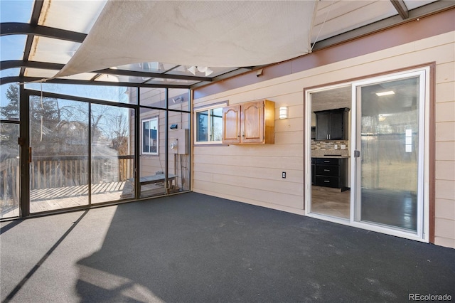 unfurnished sunroom with a healthy amount of sunlight