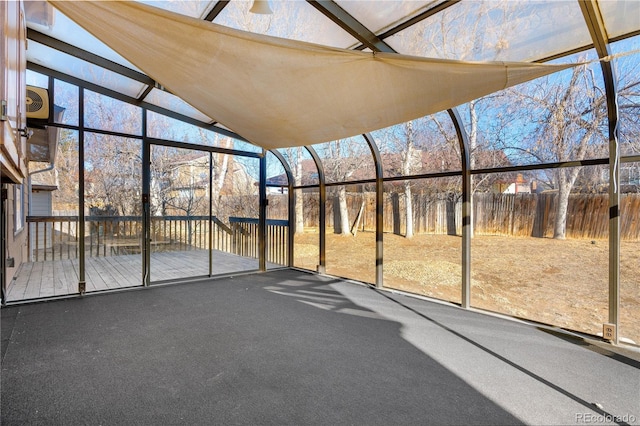 unfurnished sunroom with vaulted ceiling