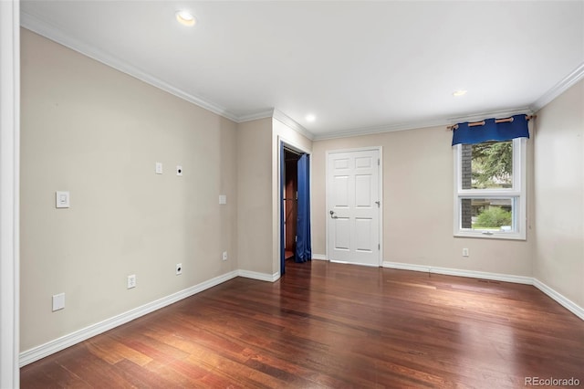spare room featuring baseboards, recessed lighting, crown molding, and wood finished floors