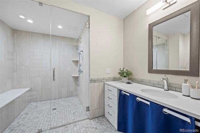 full bathroom with a stall shower, tile patterned flooring, vanity, and recessed lighting