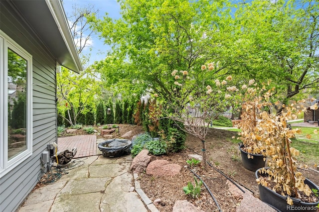 view of patio / terrace featuring an outdoor fire pit