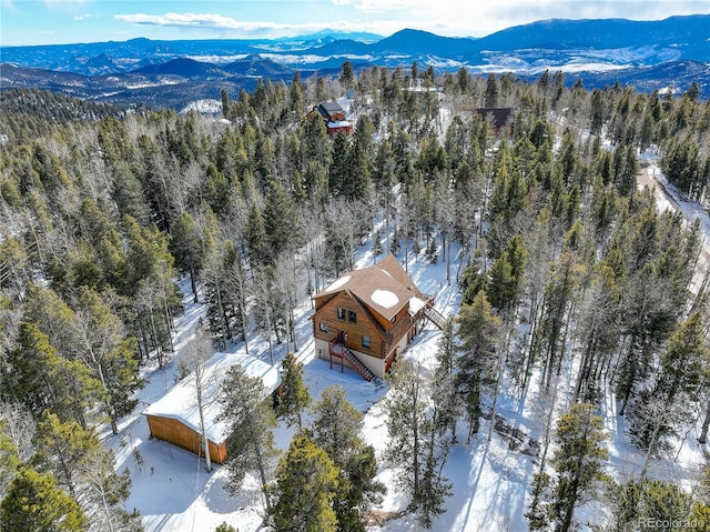 11498 Pauls Ln, Conifer, CO 80433 - snowy aerial view with a wooded view and a mountain view