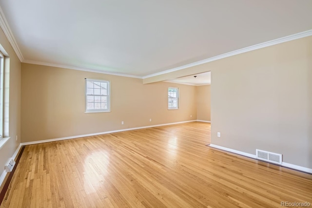 unfurnished room featuring light hardwood / wood-style flooring and ornamental molding