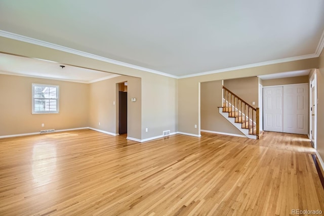 unfurnished room with crown molding and light hardwood / wood-style flooring