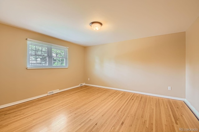 unfurnished room featuring light hardwood / wood-style floors