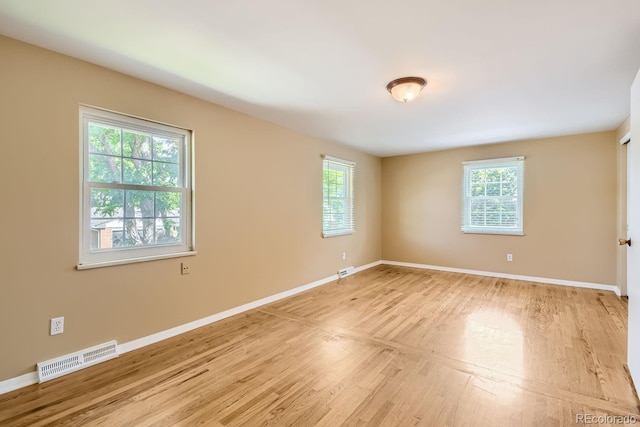 empty room with light wood-type flooring