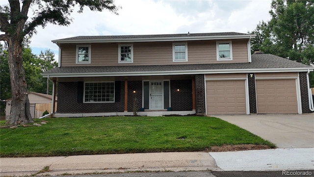 view of front property featuring covered porch, a garage, and a front lawn